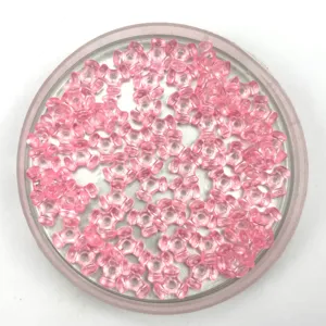 Pink translucent plastic tri-horn loose beads for DIY jewelry making and craft projects.