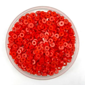 Red plastic flat round spacer beads detail shot for DIY phone case crafts and accessories