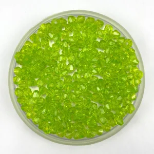 Transparent lime green bicone acrylic beads close up for DIY handmade jewelry crafts accessory.