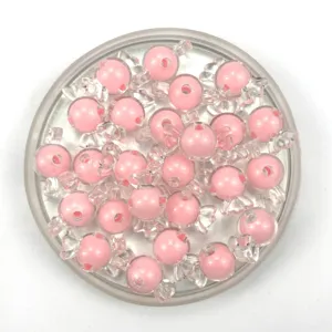 Acrylic pink candy shaped loose beads detailed closeup for DIY handmade jewelry accessories.