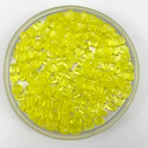 Close-up detail of yellow heart shaped plastic beads for handmade DIY jewelry crafting accessories.