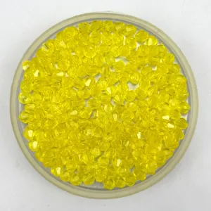 yellow crystal acrylic faceted beads closeup view of bulk beads for DIY craft use