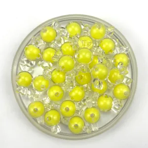 Detailed view of yellow candy-shaped acrylic loose beads for DIY jewelry making and crafts.