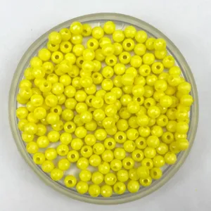 Yellow faceted acrylic round beads, perfect for DIY jewelry making and craft projects. Detail view.