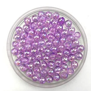 Close-up of purple iridescent acrylic round beads in detail, perfect for DIY handmade jewelry crafting.