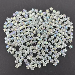 Close-up of iridescent star acrylic loose beads, perfect for DIY jewelry making details.