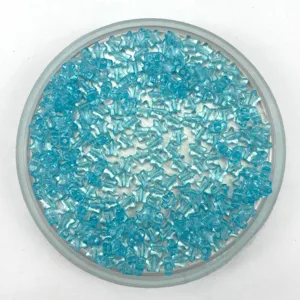 Close-up detail of transparent blue star acrylic beads for DIY crafting and jewelry making.