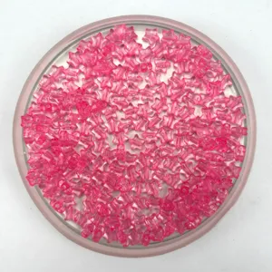 Close-up detail of pink translucent star acrylic beads, perfect for DIY jewelry making accessories.