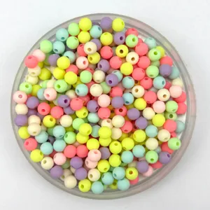Colorful mini plastic round beads mix for creative DIY jewelry making and craft projects.