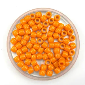 Solid orange plastic barrel beads for DIY jewelry making, hair braiding and craft projects.