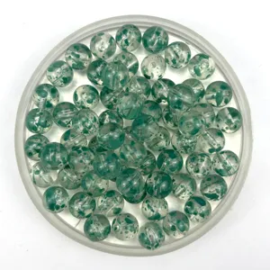 Close-up detail of transparent acrylic speckled crackle round beads for DIY jewelry making.