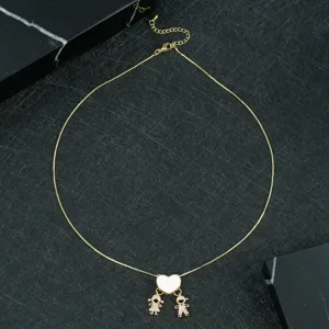 Gold-plated box chain necklace featuring a white heart pendant with cute boy and girl charms.