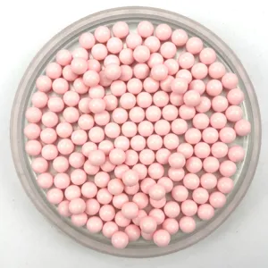 Close-up detail view of solid pink round acrylic beads, perfect for DIY jewelry and crafts.