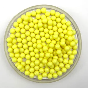 Detail view of solid yellow acrylic round beads, perfect for DIY crafts and toy marble displays.