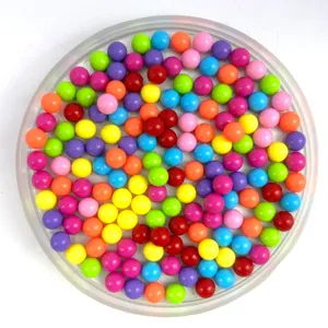 Colorful acrylic solid round beads set in transparent tray for DIY crafts, toy marbles.