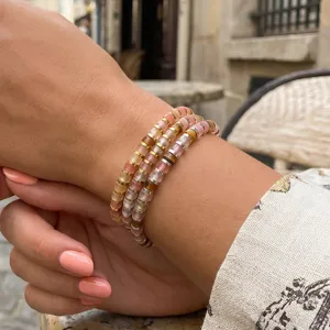 Bohemian multi-layer beaded bracelet detail shot, elegant gemstone wrist jewelry.