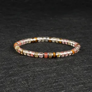 Detailed view of a multi-color gemstone and metal spacer beaded stretch bracelet for women.