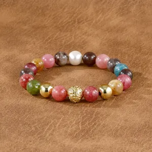 Detailed image of vintage multi-gemstone beaded bracelet featuring colorful stones and gold.