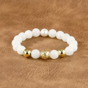 Close-up detail of the retro Chinese style beaded bracelet featuring white and gold beads.