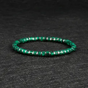 Exquisite bohemian green stone beaded bracelet with metal spacers, detail view.