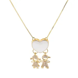 Charming gold-plated necklace with white heart and sparkling boy girl crystal pendants.