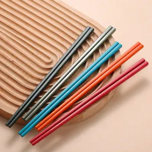 Premium alloy chopsticks set in vibrant colors, durable fiberglass material for home kitchen use.