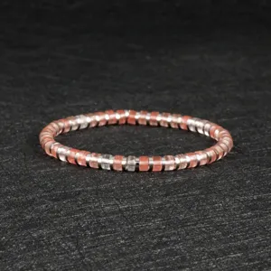 Women pink beaded bracelet with silver spacers, elegant jewelry for daily wear style.