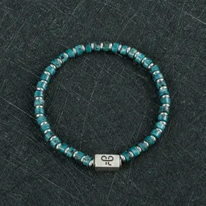 Stijlvolle turkoois edelsteen kralen armband met metalen tussenstukken en mooie unieke hanger.