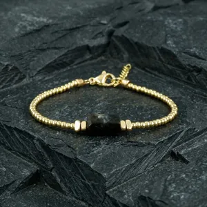 Natural crystal beaded bracelet, gold color retro style detail shot, elegant jewelry accessory.