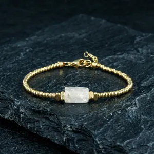 Detail view of vintage style natural crystal stone beaded bracelet with gold tone beads.