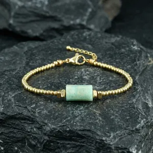 Close-up detail of the vintage green stone and gold beaded adjustable bracelet for women.