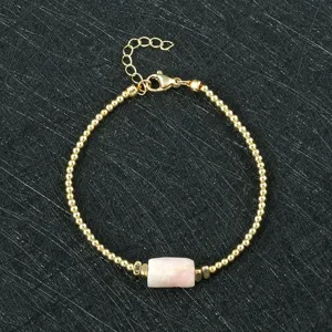 Elegant gold beaded bracelet with natural pink stone centerpiece adjustable fashion jewelry