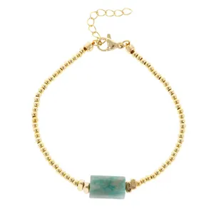 Natural crystal beaded bracelet with turquoise stone cylinder and adjustable gold chain.