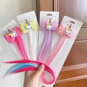 Children's colorful hair extension clips with unicorn sequin bows, perfect for kids party styles.