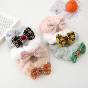 Plush tweed bow scrunchies detail view, cute fuzzy winter hair ties for women and girls.