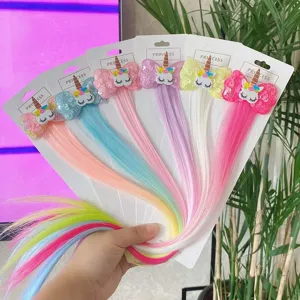 Kids colorful gradient synthetic hair extension clip with cute unicorn sequin bow detail view.