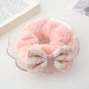 Pink plush hair scrunchie with tweed bow, cute winter hair accessory for women and girls.