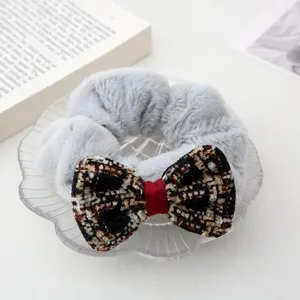 Grey plush hair scrunchie with tweed plaid bow winter cute hair accessory for women.