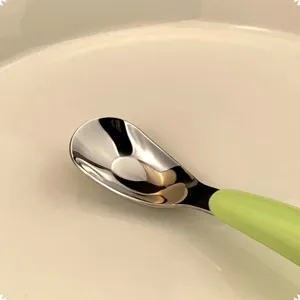 Children's 316L stainless steel deepened feeding spoon with green handle main product view