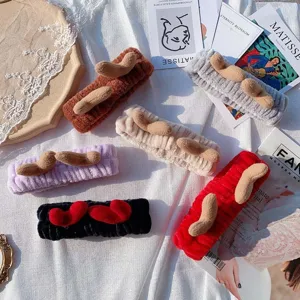 Coral fleece cute antler hair band for daily face washing and makeup, soft plush material.