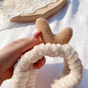 Fluffy coral fleece plush deer antler headband detail, soft texture for washing face makeup.
