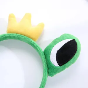 Diadema de rana de peluche verde con corona ojos grandes accesorio divertido de pelo.