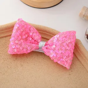 Pince à cheveux nœud papillon à paillettes roses scintillantes avec centre argenté mignon.
