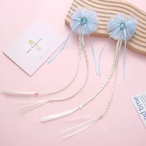 Girls blue hair clip with cute bow, crystal stone and long braided hair extensions for kids.