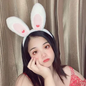 Cute plush bunny ear headband detail, soft white and pink hair hoop for sweet daily wear.