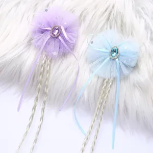 Kids wig hair clip detail showing purple and blue bow mesh with cute braided extensions.