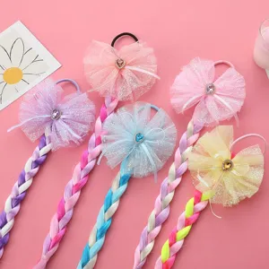 Detailed view of colorful mesh bow braided hair ties, perfect for cute kids party decoration.