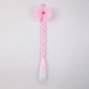 Pink gradient braided hair extension featuring cute tulle bow and sparkly rhinestone detail.