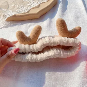 Cute plush deer antler headband for face washing and makeup, soft coral fleece hair band.
