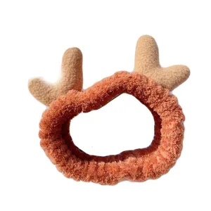 Fluffy plush deer antler headband for women, soft coral fleece hair hoop for daily face washing.